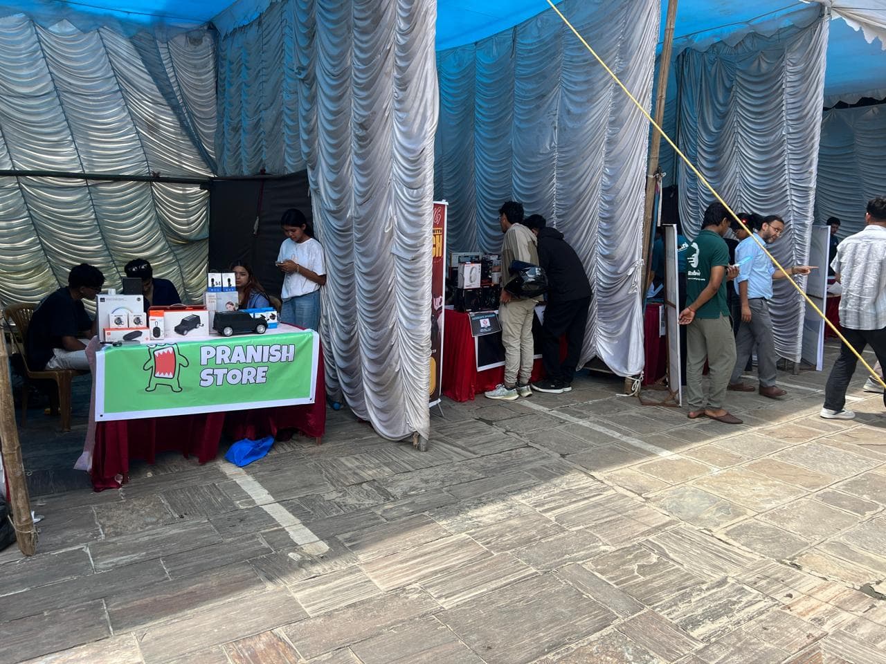 Visitors explore startup and tech stalls, including Pranish Store, at the Uniglobe IT expo and Startup mela 2025.