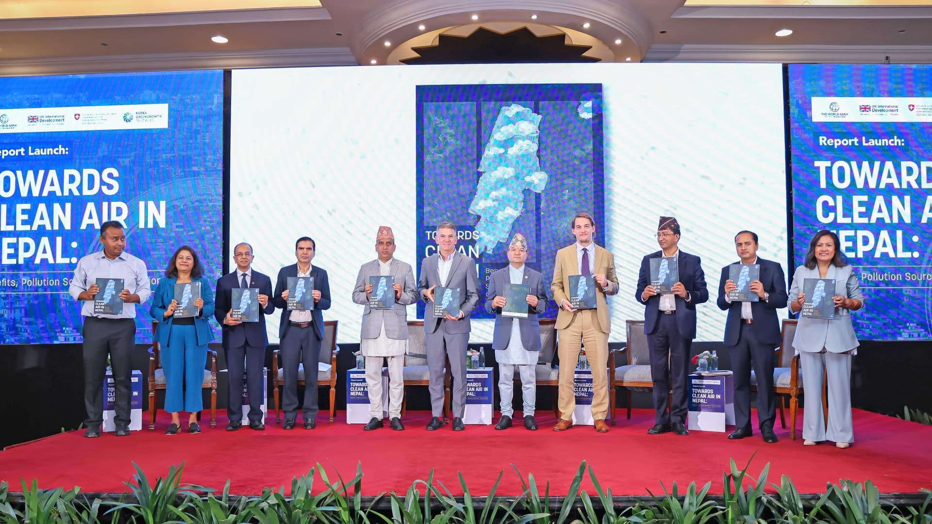 10 people (including 2 females) holding the Report “Towards Clean Air in Nepal: Benefits, Pollution Sources and Solutions” by World bank at launch event held at Hotel Soaltee, on June 17, 2025, in Kathmandu.